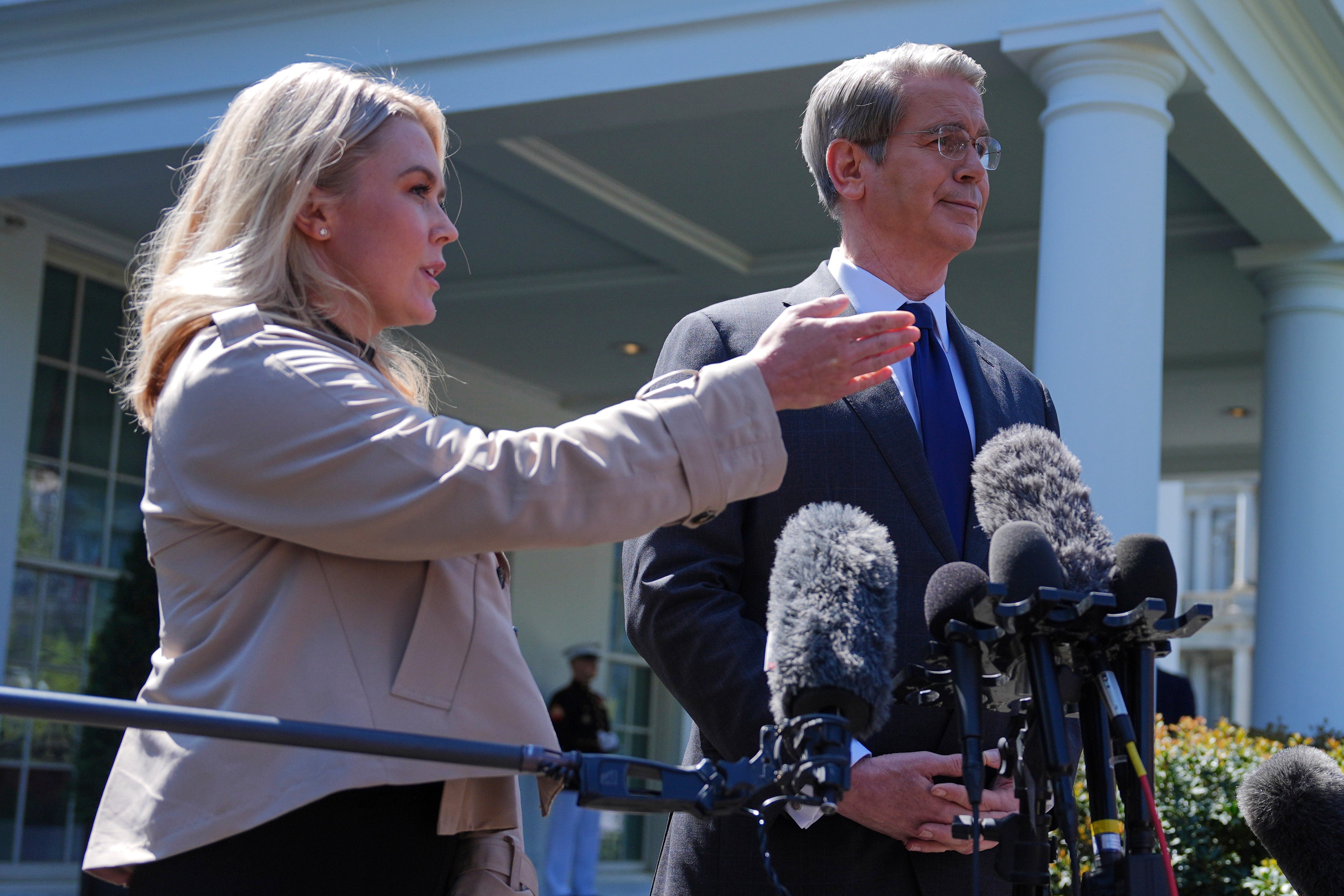 Treasury Secretary Scott Bessent and White House press secretary Karoline Leavitt speak with reporters outside the West Wing of the White House, Wednesday, April 9, 2025, in Washington.