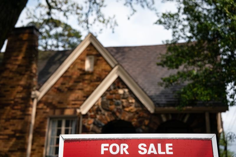 A "For Sale" sign in front of a home in Little Rock, Arkansas, on April 4. Sales of previously owned homes dropped 5.9% in March from the prior month.