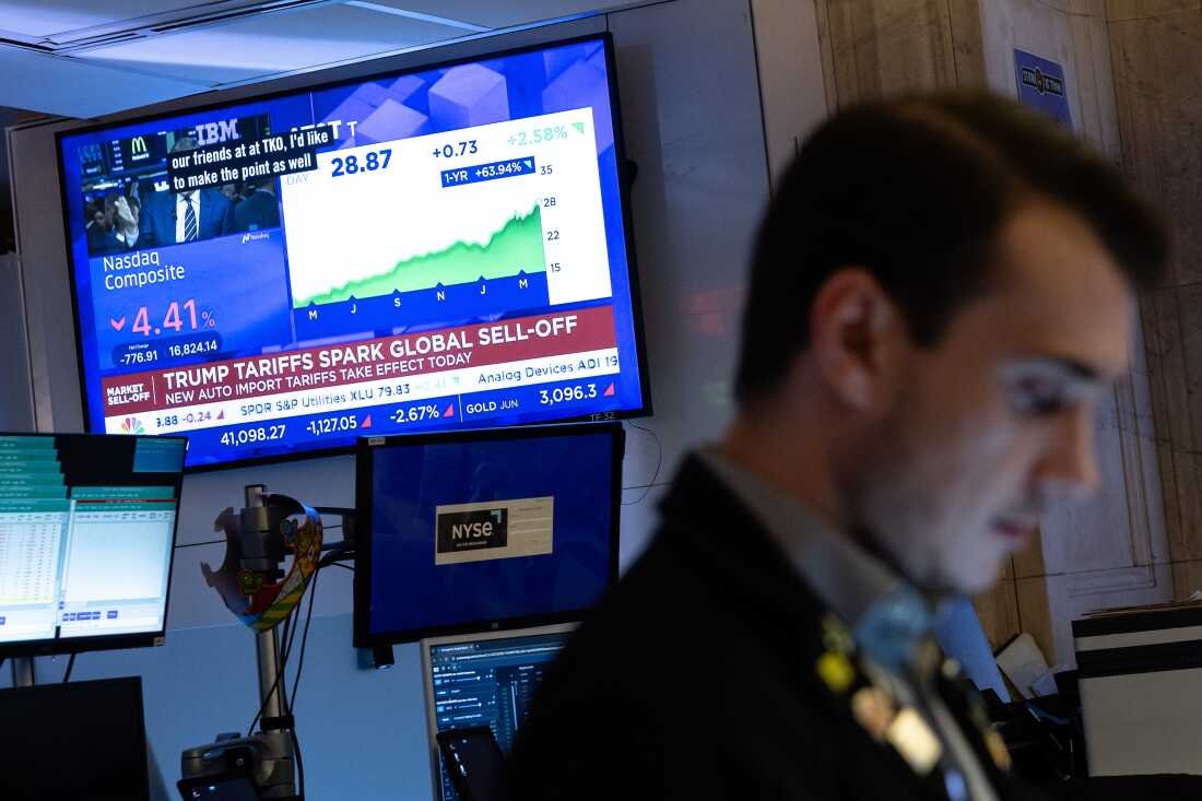 Traders work on the floor of the New York Stock Exchange on Thursday, which saw the worst markets selloff in five years.