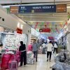 People walk through a building in Yiwu International Trade City, a massive wholesale market in Yiwu, China, where millions of Chinese-made items are sold.
