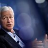 JPMorgan Chase CEO Jamie Dimon, pictured at a meeting in October, warned Monday that tariffs will raise prices, slow economic growth and hurt U.S. global standing.