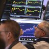 Traders work on the floor Monday at the New York Stock Exchange in New York.
