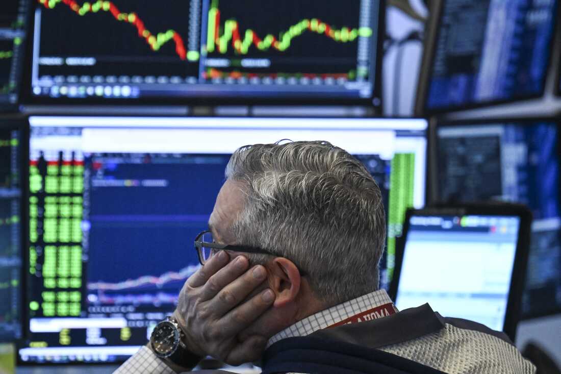 A trader works on the floor of the New York Stock Exchange.