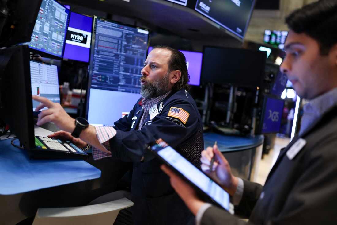 Traders work on the floor of the New York Stock Exchange (NYSE) at the opening bell on April 10, 2025, in New York City. Stocks resumed declines after gaining spectacularly a day earlier.