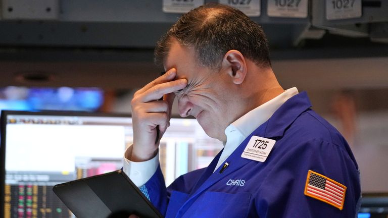 A person works on the floor at the New York Stock Exchange in New York, Monday, March 31, 2025. Pic: AP