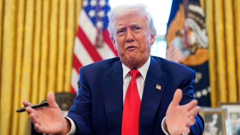 U.S. President Donald Trump speaks, as he signs executive orders and proclamations in the Oval Office at the White House in Washington, D.C., U.S., April 9, 2025. REUTERS/Nathan Howard
