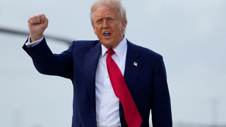 U.S. President Donald Trump gestures as he disembarks Air Force One as he arrives at Miami International Airport in Miami, Florida, U.S., April 3, 2025. REUTERS/Kent Nishimura