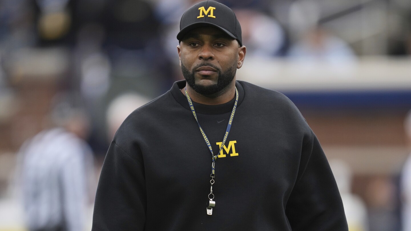 michigan-to-suspend-sherrone-moore-for-2-games-to-address-ncaa-allegations,-ap-sources-say