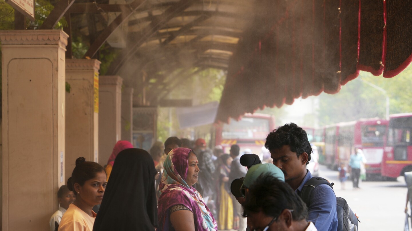 in-one-indian-city,-reflective-paint-and-bus-stop-sprinklers-offer-relief-from-killer-heat