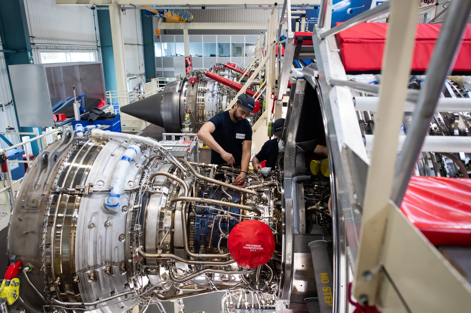 Employees work on a Rolls-Royce Trent 7000 engine for an Airbus SE A330neo aircraft at the Safran SA plant in Colomiers, France, on March 25, 2025.
