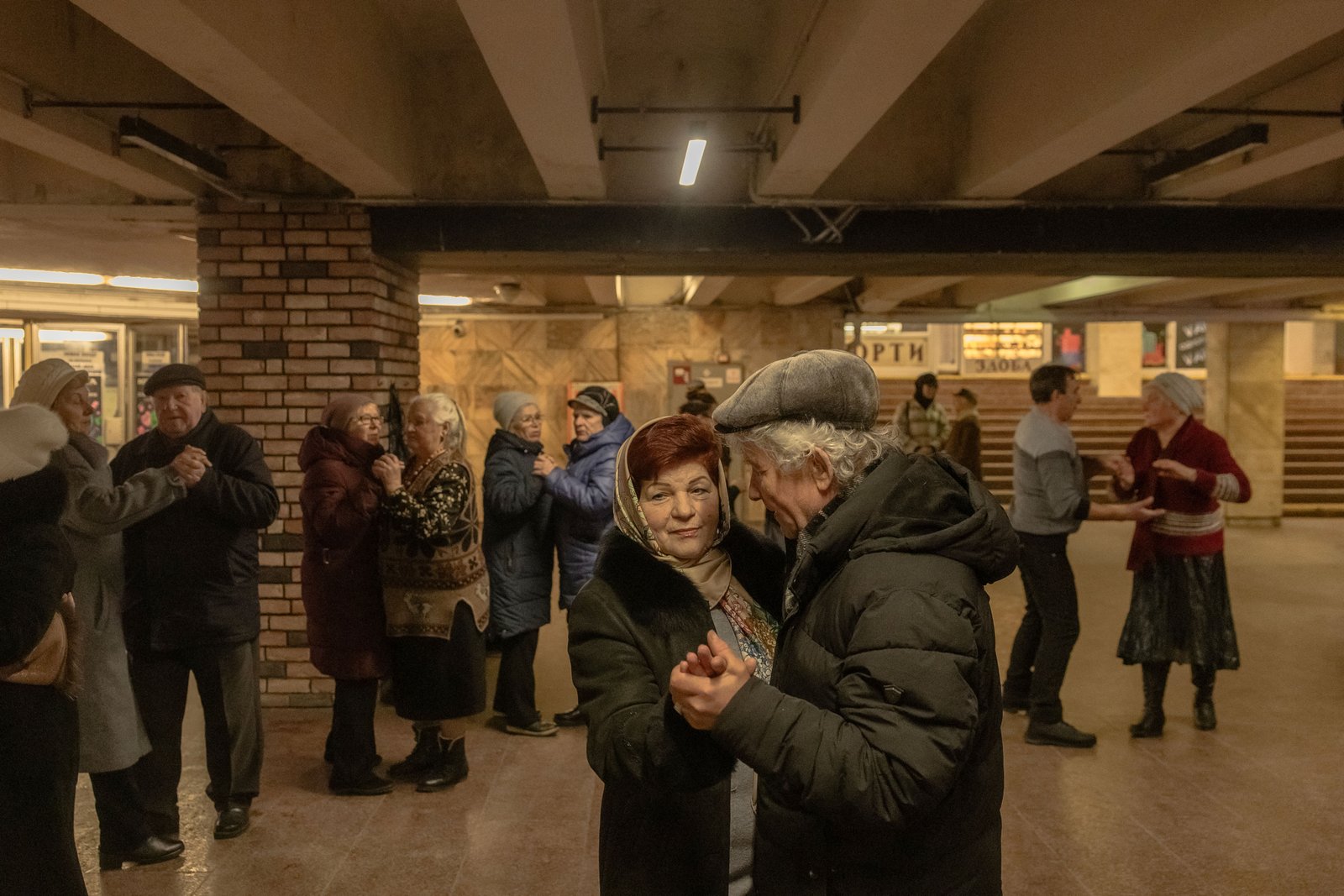 TOPSHOT - People dance in an underground passage in downtown Kyiv, on February 23, 2025, on the eve of the third anniversary of Russia's invasion of Ukraine. (Photo by Roman PILIPEY / AFP) (Photo by ROMAN PILIPEY/AFP via Getty Images)