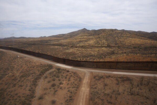A view from an U.S. Army Blackhawk helicopter as it flies along the US-Mexico border as part of Joint Task Force Southern Border Thursday, April 3, 2025, in Douglas, Ariz. (AP Photo/Ross D. Franklin)