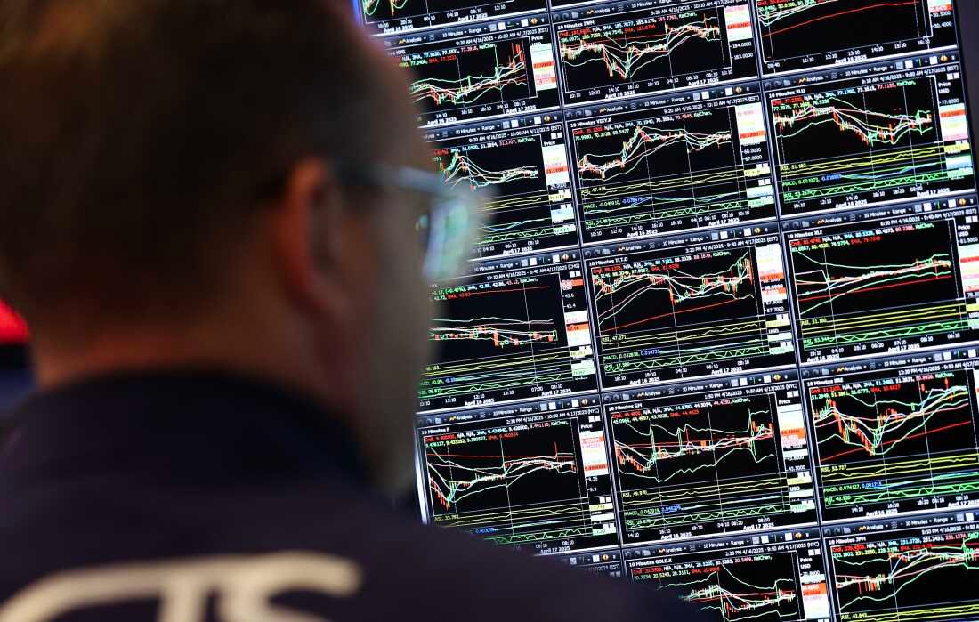 A trader works on the floor of the New York Stock Exchange (NYSE) on April 17, as the Dow was pressured by UnitedHealth Group's disappointing profit outlook. Over the past month, shares in the massive health care conglomerate have plunged more than 50 percent. (Photo by TIMOTHY A. CLARY/AFP via Getty Images)
