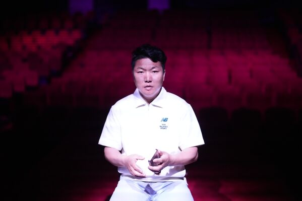 Xing Jiangtao, a 37-year-old Chinese, who has been working for Dongchoon Circus Troupe since 2002, speaks during an interview. (AP Photo/Lee Jin-man)