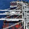 Colorful shipping containers stacked at the Port of Oakland.