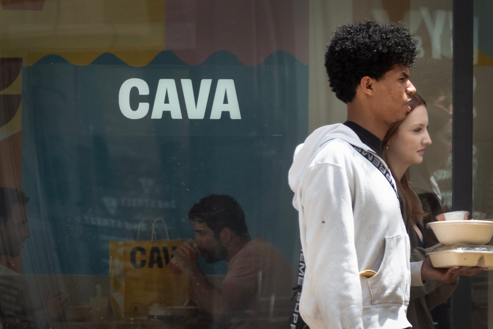 Customers take out food from a Cava restaurant in Chicago, Illinois, on May 28, 2024.