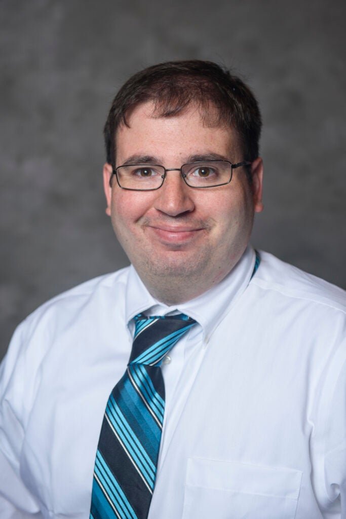 Associate Professor of Economics Mark Schneider