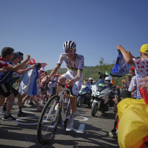 Slovenia's Tadej Pogacar climbs towards Hautacom to win the twelfth stage of the Tour de France cycling race over 180.6 kilometers (112.2 miles) with start in Auch and finish in Hautacam, France, Thursday, July 17, 2025. (AP Photo/Thibault Camus)