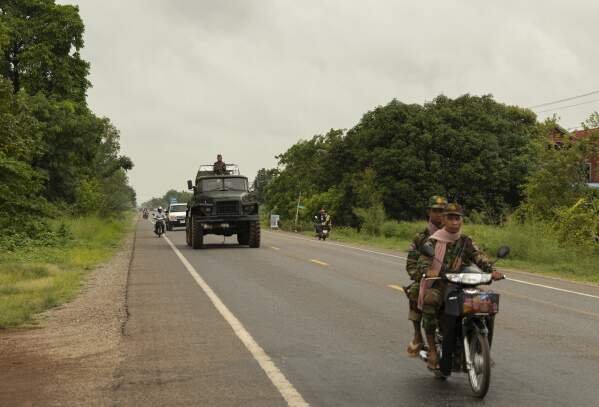A Cambodian military convoy drives towards the border city of Samrong in Oddar Meanchey Province on Saturday, July 26, 2025. (AP Photo/Anton L. Delgado)
