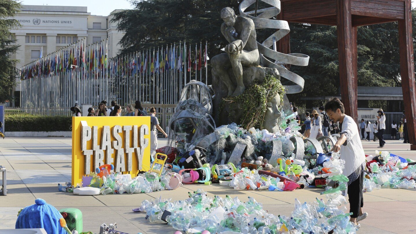 artist-drowns-sculpture-in-plastic-waste-in-front-of-the-un-during-plastic-pollution-treaty-talks