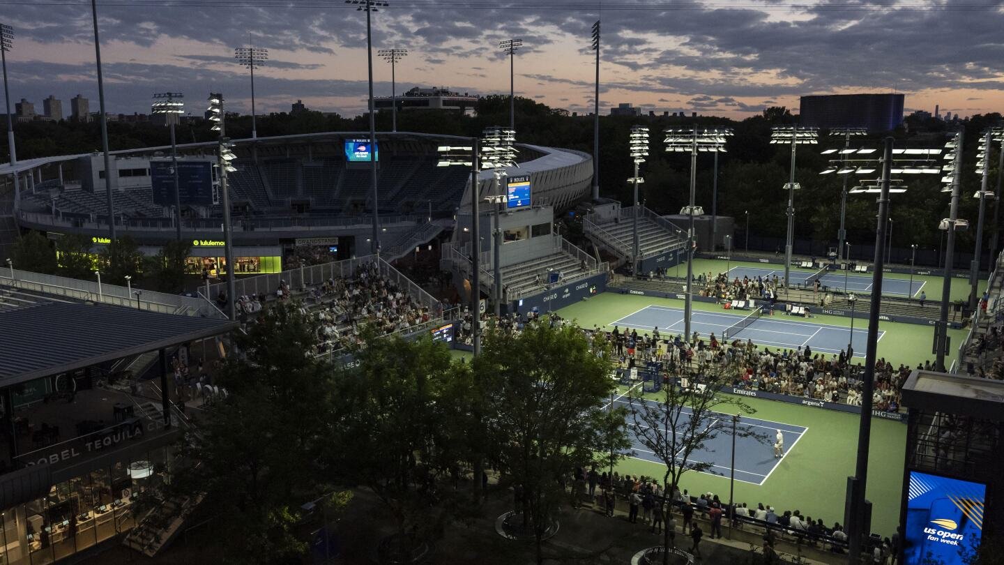 at-the-us-open,-tennis-stars-shine-under-dark-sky-friendly-outdoor-lights