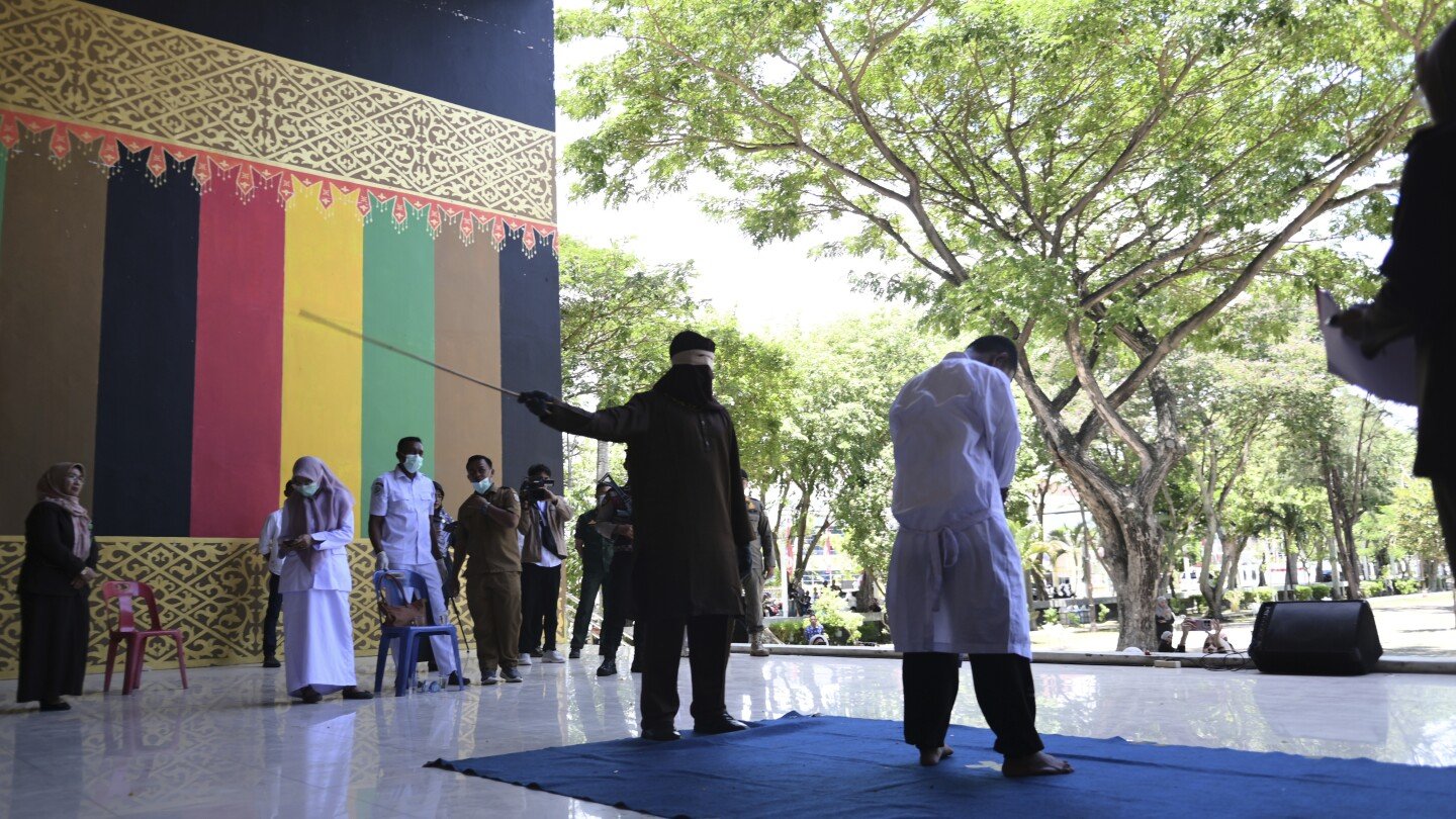 men-charged-with-hugging-and-kissing-are-among-group-publicly-caned-by-indonesian-islamic-court