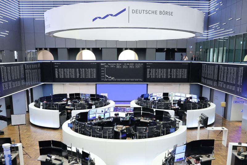 Traders work in the stock exchange in Frankfurt, Germany, on August 1.