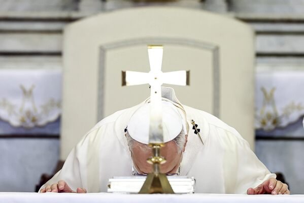 Pope Leo XIV celebrates a mass inside the St. Thomas of Villanova Church in Castel Gandolfo, Italy, Friday, Aug.15, 2025. (Angelo Carconi/Pool Via AP)