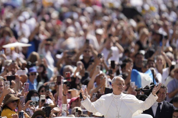 Pope Leo XIV gestures as he arrives for his weekly general audience in St. Peter's Square at The Vatican, June 4, 2025. (AP Photo/Gregorio Borgia, File)