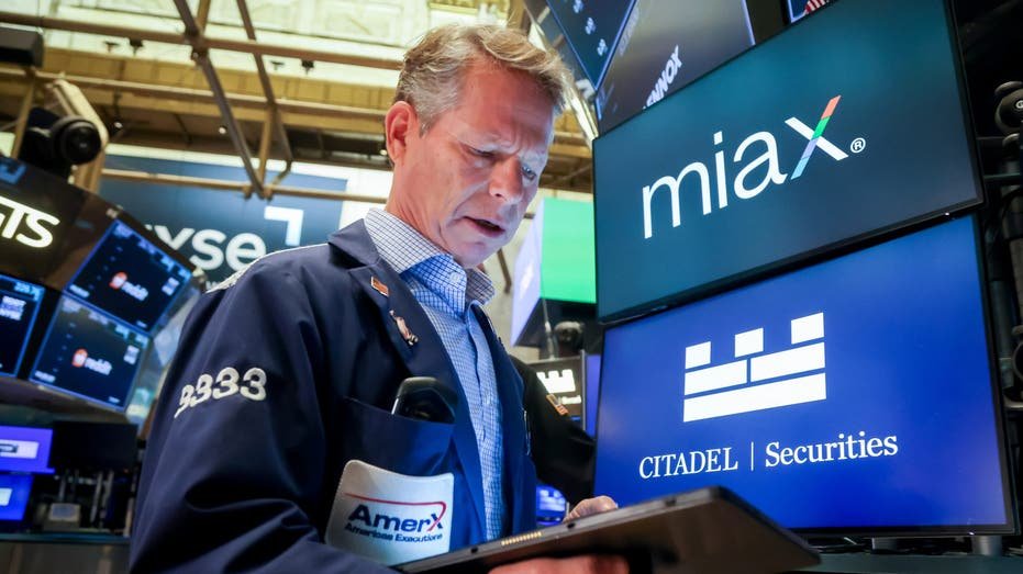 NYSE Trader as Miami International Holdings (MIAX) goes public in the company's initial public offering (IPO) on the floor of the New York Stock Exchange (NYSE) in New York, US, on Thursday, Aug. 14, 2025.