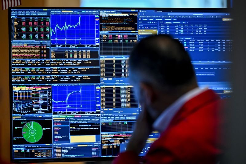 A trader works on the floor of the New York Stock Exchange during morning trading on August 13, in New York.