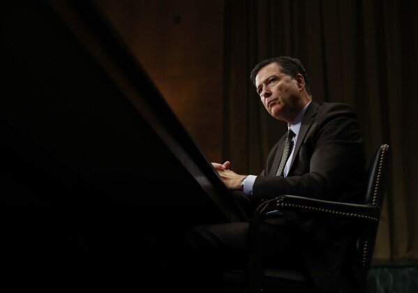FILE - FBI Director James Comey pauses as he testifies on Capitol Hill in Washington, May 3, 2017, before the Senate Judiciary Committee hearing: 