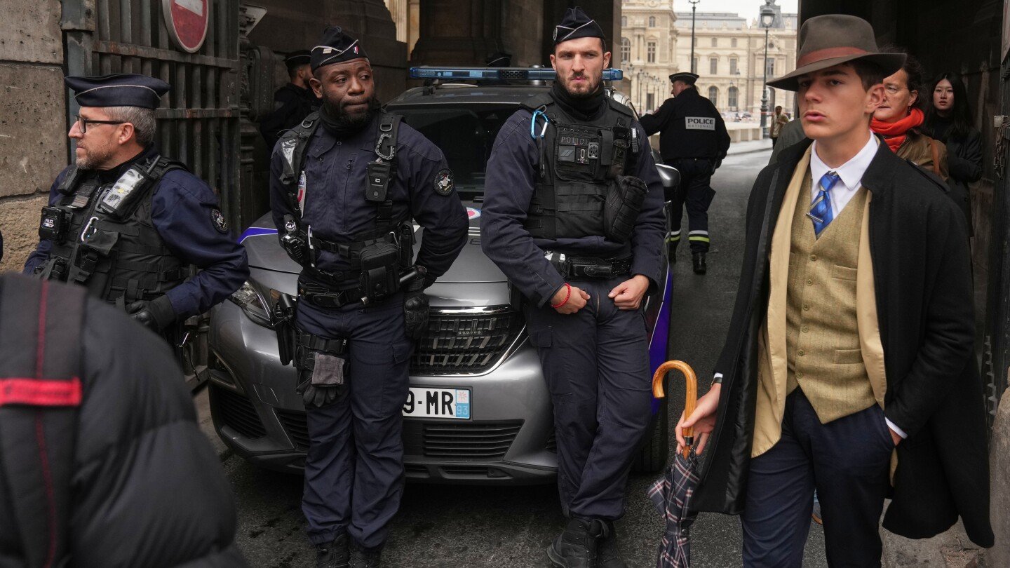 inspector-clouseau?-the-mystery-man-in-an-ap-photo-after-the-louvre-jewel-heist-creates-a-buzz