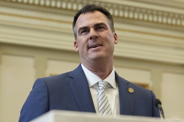 FILE - Oklahoma Gov. Kevin Stitt delivers his State of the State address on Feb. 6, 2023, in Oklahoma City. Oklahoma’s new Republican Attorney General Gentner Drummond accused Stitt on Tuesday, July 25, 2023, of failing to follow state law and said he’s stepping into a long running legal dispute over gambling agreements Stitt signed in 2020. (AP Photo/Sue Ogrocki, File)