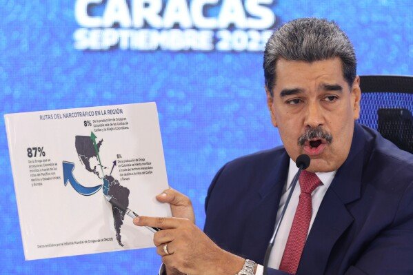 FILE - Venezuelan President Nicolas Maduro points at a map of the Americas during a new conference in Caracas, Venezuela, Sept 15, 2025. (AP Photo/Jesus Vargas), File