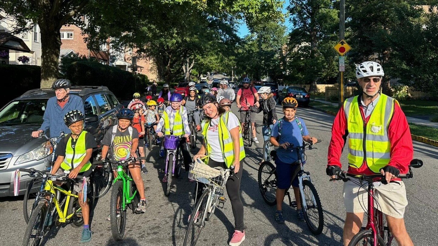 from-a-few-to-more-than-350,-children-and-parents-ride-together-to-school-as-a-‘bike-bus’