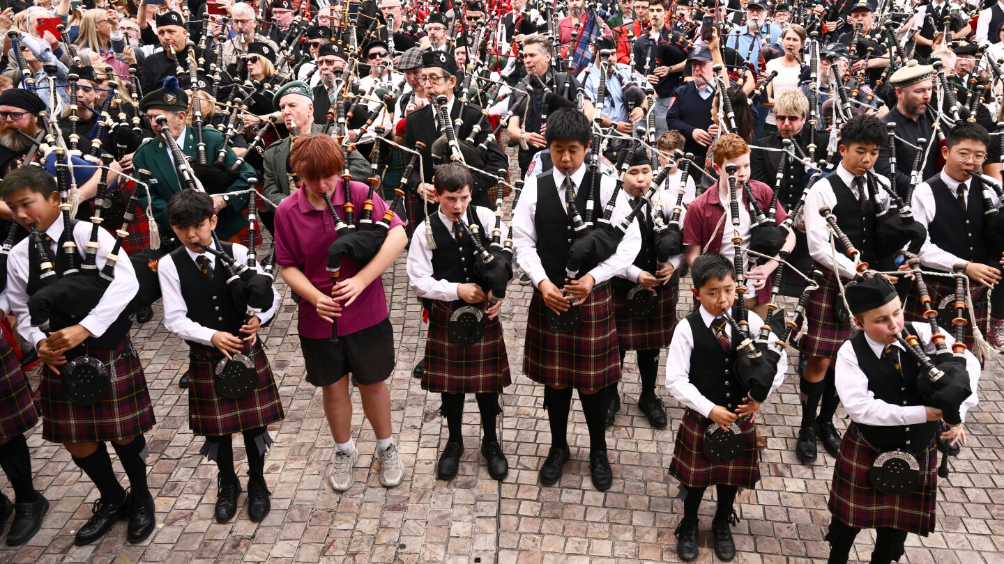 bagpipers-claim-world-record-with-ac/dc’s-‘it’s-a-long-way-to-the-top’