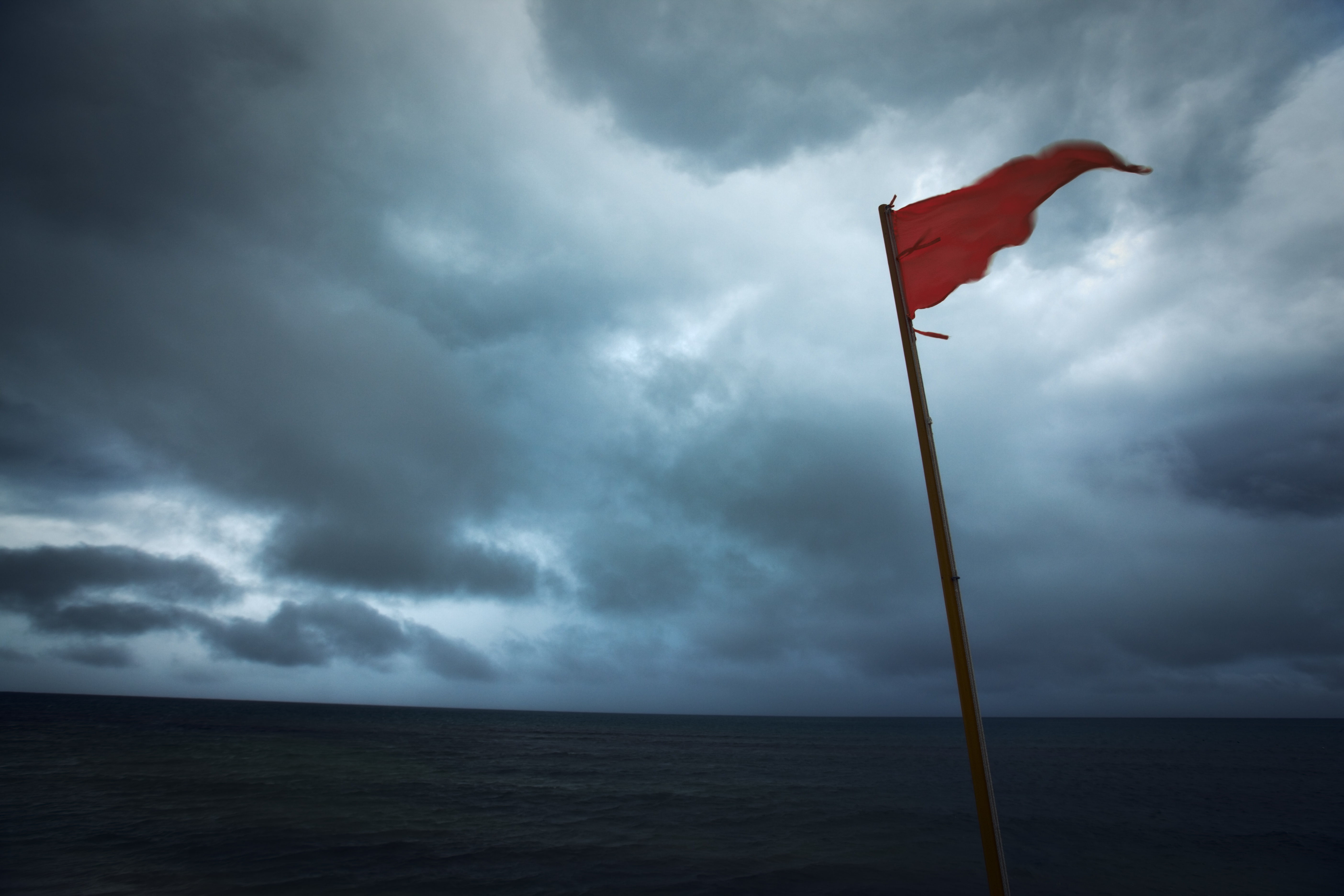 Red Flag Warning Hurricane Storm Danger of Dark Sea Clouds