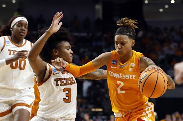 Tennessee guard Ruby Whitehorn (2) dribbles around Texas guard Rori Harmon (3) during the first half in the Sweet 16 of the NCAA college basketball tournament, March 29, 2025, in Birmingham, Ala. (AP Photo/Butch Dill)