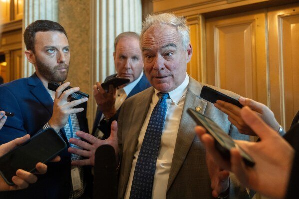 Sen. Tim Kaine, D-Va. speaks to reporters at the Capitol, Oct. 1, 2025, in Washington. (AP Photo/Manuel Balce Ceneta)
