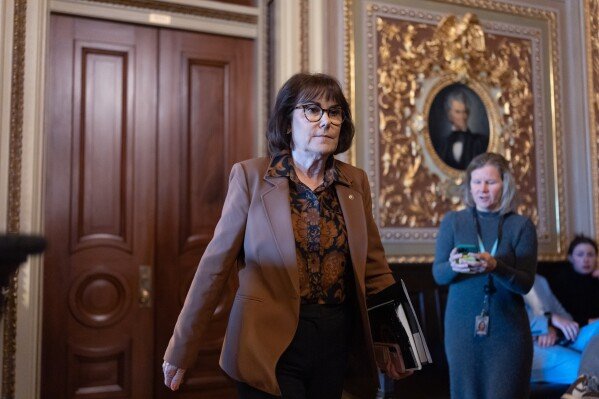 Sen. Jacky Rosen, D-Nev., leaves other Senate Democrats at a closed-door meeting at the Capitol looking for a solution to the spending impasse, in Washington, Thursday, Nov. 6, 2025, day 37 of the government shutdown. (AP Photo/J. Scott Applewhite)