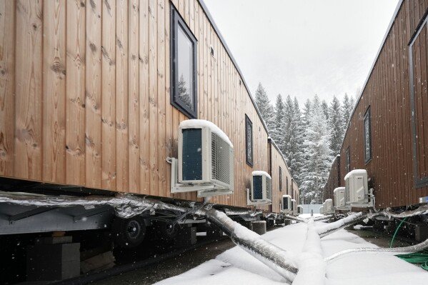 A view of the trailer homes at the athlete's village for the Cortina Milan Winter Olympics, in Cortina D'Ampezzo, Italy, Monday, Nov. 24, 2025. (AP Photo/Andrew Medichini)