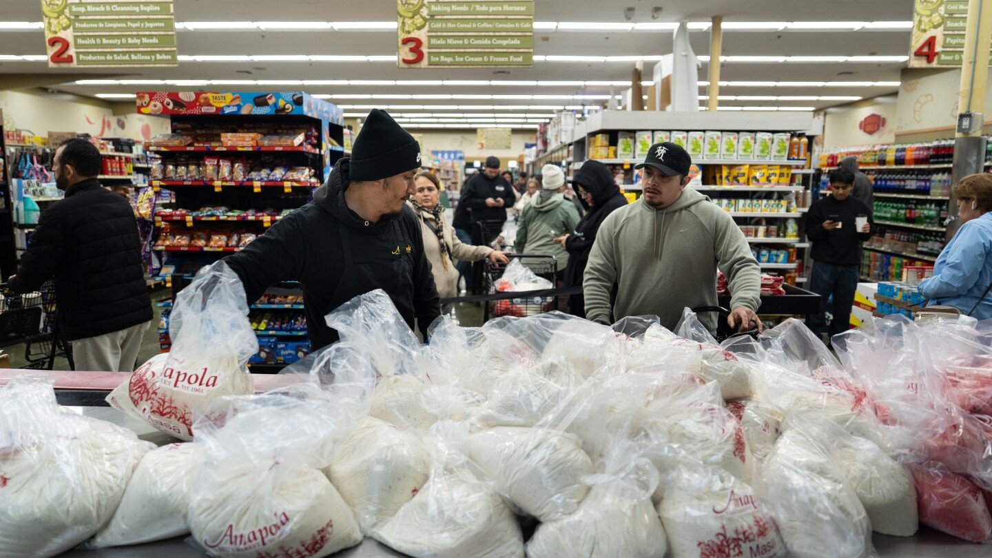 families-wait-in-line-for-hours-to-buy-masa-for-christmas-tamales-at-beloved-la-grocer