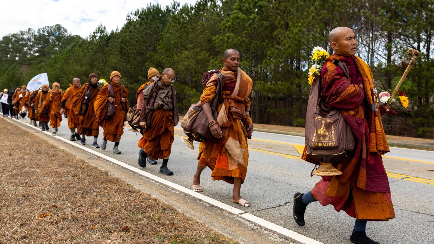 buddhist-monks-persist-in-peace-walk-despite-injuries-as-thousands-follow-them-on-social-media