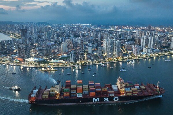 A container ship approaches the Port of Santos, the largest port in Brazil, which plays a key role in the country's trade and logistics, on April 1, 2025. (AP Photo/Andre Penner)