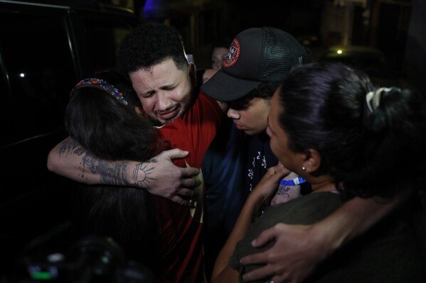 Arturo Suárez, a Venezuelan migrant deported to El Salvador months earlier by the United States under the Trump administration's immigration crackdown, is welcomed home by his relatives in Caracas, Venezuela, on July 22, 2025. (AP Photo/Cristian Hernandez)