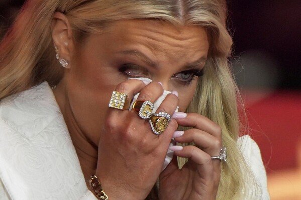 Erika Kirk wipes tears as she prepares to speak at a memorial for her husband, conservative activist Charlie Kirk, on Sept. 21, 2025, in Glendale, Ariz. (AP Photo/Julia Demaree Nikhinson)