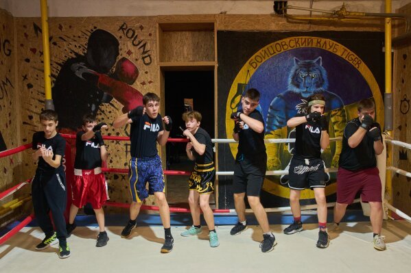 Children practice at a boxing school in an underground shelter in the frontline city of Kherson, southern Ukraine, on Nov. 2, 2025. (AP Photo/Efrem Lukatsky)
