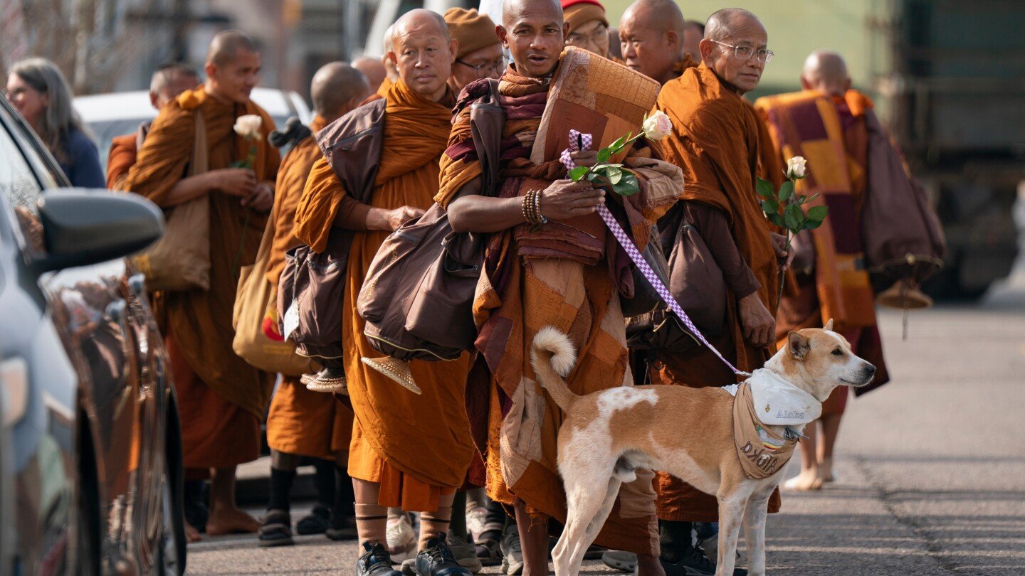buddhist-monks-and-their-dog-captivate-americans-while-walking-for-peace