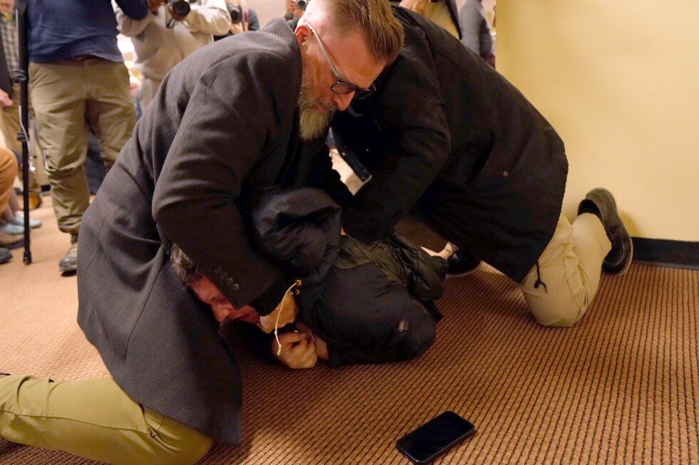 man-tackled-to-ground-after-spraying-unknown-substance-on-rep.-ilhan-omar-at-minneapolis-town-hall